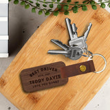 Engraved wood & leather keychain, close-up of custom text. Image 2 of 10.